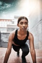 Be your own best competitor. Shot of a sporty young woman exercising outdoors. Royalty Free Stock Photo