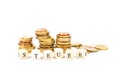 Shot of stacked coins with the German word for taxes on small wooden cubes Royalty Free Stock Photo