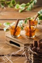 Shot with strong alcohol and cinnamon on a wooden table Royalty Free Stock Photo