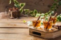 Shot with strong alcohol and cinnamon on a wooden table Royalty Free Stock Photo