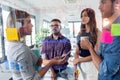 Successful business team discussing together in front of office glass board in the coworking space Royalty Free Stock Photo