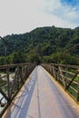 Shot of the suspension bridge in the mountains. Objects Royalty Free Stock Photo