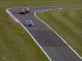 Three Racing Cars Cornering