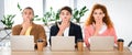 Shot of three shocked friends sitting at table and obscuring faces