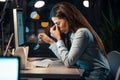 Tired business woman with neck pain looking uncomfortable while working with computer in the office at night Royalty Free Stock Photo