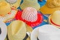 Traditional straw hats in a street market on a sunny morning Royalty Free Stock Photo