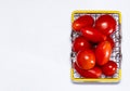 Shot of tomatoes in shopping basket isolated on white background with copy space. Ripe tasty red tomatos in shopping basket. Top Royalty Free Stock Photo