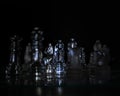 Shot of transparent chess pieces on a black background Royalty Free Stock Photo