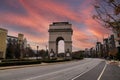 A shot of the Triumphal arch at the Millennium Gate Museum with African Americans underneath surrounded by buildings