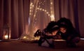 Theyre totally enchanted. Shot of two adorable little girls looking at a glowing box in a dark room at home.