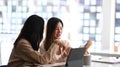 Shot of two business partners using tablet computer and discussing project strategy in office. Royalty Free Stock Photo