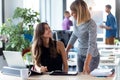 Two business young women working together with digital tablet in the modern startup office Royalty Free Stock Photo