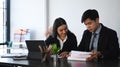 Shot of two businesspeople discussing financial  report in office. Royalty Free Stock Photo