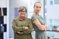 Were the women leading the business. Shot of two businesswomen standing together in the office with their arms folded. Royalty Free Stock Photo