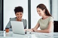 I really appreciate your input on this. Shot of two businesswomen using a laptop together in an office. Royalty Free Stock Photo