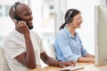 How may I help you today. Shot of two call center workers together. Royalty Free Stock Photo