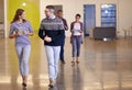 They value each others expertise. Shot of two colleagues discussing work while walking alongside each other. Royalty Free Stock Photo