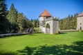 Shot of two cyclers cycling and the beautiful Masun Castle in Slovenia Royalty Free Stock Photo