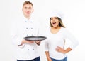 Shot of two emotional cheerful professional kitchen chefs posing together hold empty tray at the white background. Happy handsome