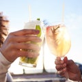 .. Shot of two female friends celebrating with drinks at a bar outside. Royalty Free Stock Photo