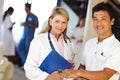 Caring health professionals. Shot of two medical professionals smiling at the camera. Royalty Free Stock Photo