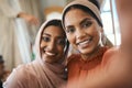 There is no greater love than sibling love. Shot of two muslim sisters taking selfies together. Royalty Free Stock Photo