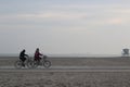 Shot of two people riding bicycles in Long Beach, California