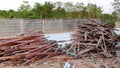 Shot of two piles of wood at a construction site.