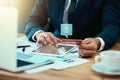 Browsing with his global shopping cart. Shot of an unidentifiable businessman making a credit card payment online. Royalty Free Stock Photo