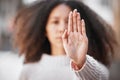 We need women at all levels. Shot of an unrecognizable woman making the stop sign with her hand outside. Royalty Free Stock Photo