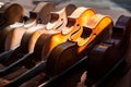 Shot of various violins aligned on the display of a  musical instrument shop Royalty Free Stock Photo