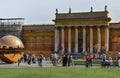 Shot of a Vatican museum with people sightseeing in front of