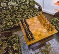 Shot of the vintage chessboard with black and white chess pieces. Concept Royalty Free Stock Photo