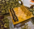 Shot of the vintage chessboard with black and white chess pieces. Concept Royalty Free Stock Photo