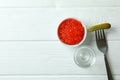 Shot of vodka, caviar and pickle on white wooden background Royalty Free Stock Photo