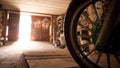 Shot of a wheel of the motorcycle part in the garage with opening door