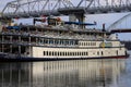 A shot of a white and red steam boat sailing on the Cumberland River near the John Seigenthaler Pedestrian Bridge Royalty Free Stock Photo