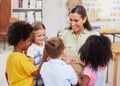 My students love making music. Shot of a woman teaching her class about musical instruments. Royalty Free Stock Photo