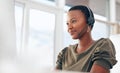 If you need us, call. Shot of a woman wearing a headset while working in a call centre. Royalty Free Stock Photo