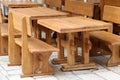 Shot of wooden tables and chairs of a cozy street restaurant in summer Royalty Free Stock Photo