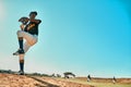 Get ready. Shot of a young baseball player pitching the ball during a game outdoors. Royalty Free Stock Photo