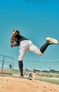 Hes giving it his all. Shot of a young baseball player pitching the ball during a game outdoors. Royalty Free Stock Photo
