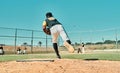 He throws nothing but fast pitches. Shot of a young baseball player pitching the ball during a game outdoors. Royalty Free Stock Photo