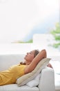 Naps are the best part of a lazy weekend. Shot of a young blonde woman relaxing on the sofa at home. Royalty Free Stock Photo