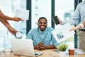 Its important to stay cool, calm, and collected. Shot of a young businessman looking calm in a demanding office Royalty Free Stock Photo