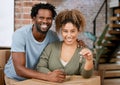 A mans home is his wifes castle. Shot of a young couple showing keys to their new home. Royalty Free Stock Photo