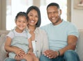 Its a family kind of weekend. Shot of a young couple sitting on their sofa at home with their daughter.