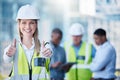 Uplifting myself to a better place. Shot of a young female construction worker giving the thumbs up. Royalty Free Stock Photo