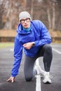 Shot of a young handsome professional runner looking at camera.