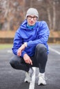 Shot of a young handsome professional runner looking at camera.